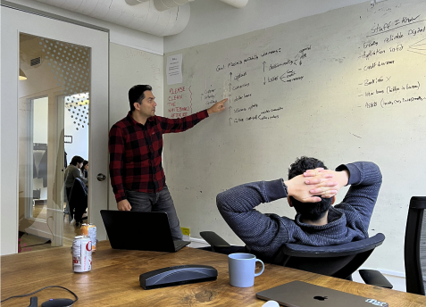 Team whiteboarding session mapping the funnel